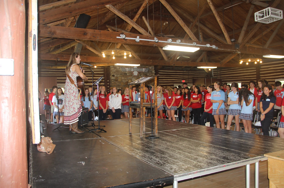 The freshman sing songs to God with Mr. Quintero’s mother (Credit: Charlotte Catholic High School)