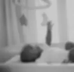 baby playing with mobile