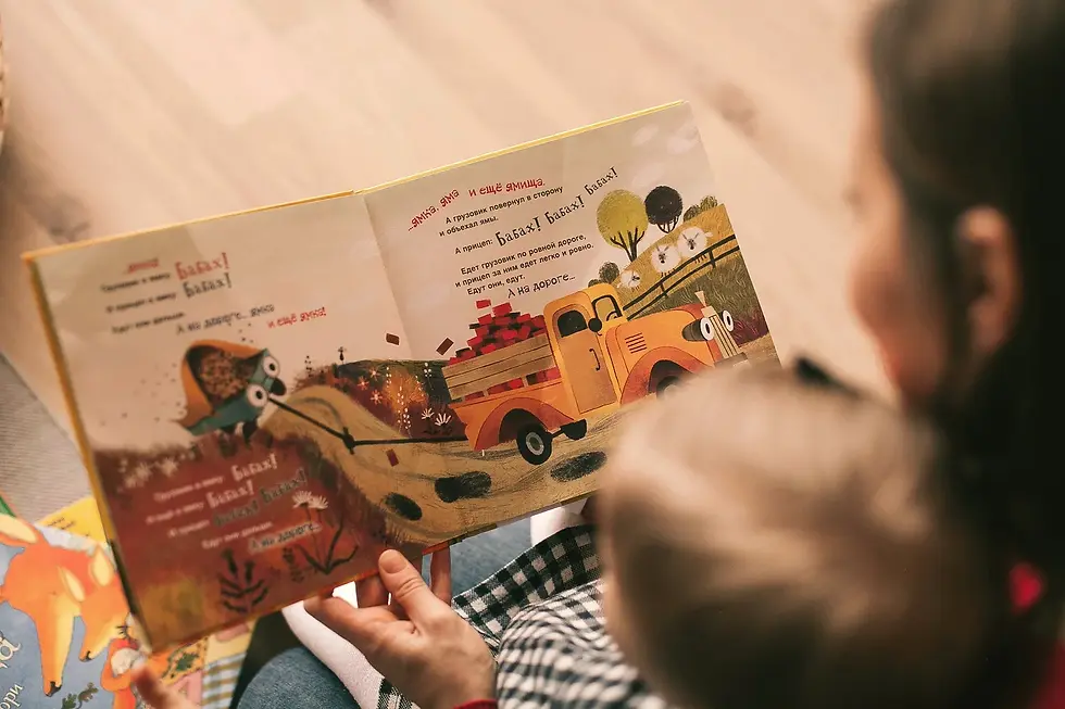 mom reading toddle a book