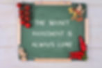 image of a chalk board with the writing "The secret ingredient is always love".