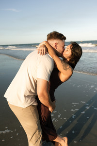 Couple dancing near the beach sharing affection