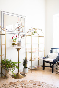 beautiful entryway at Hutch and Hive Social with brass accents and wicker carpet