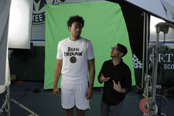 Filling Jabari in on the shoot.