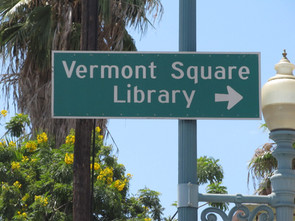 Vermont Square Library sign with arrow pointing right