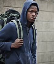 Homeless Teenage Boy On Streets With Ruc