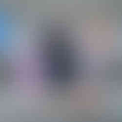 Family in front of the avengers sign