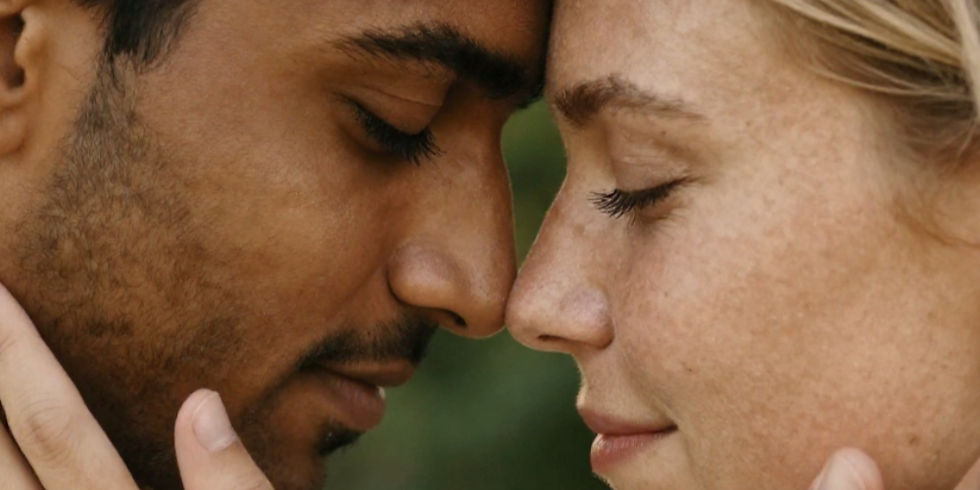 A couple with foreheads touching