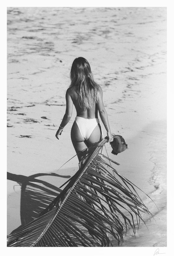 Topless girl with palm in Jamaica. Topless girl on beach with palm tree. 
