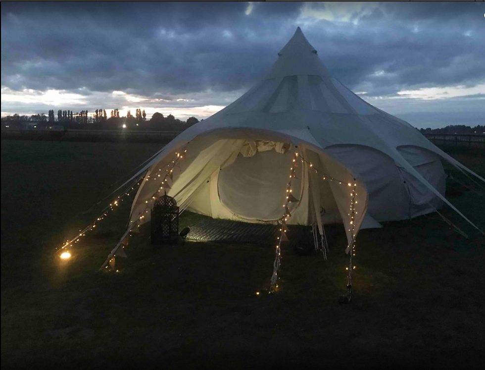 A stargazer bell tent with fairy lights