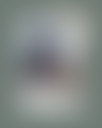 woman at computer with notes around her