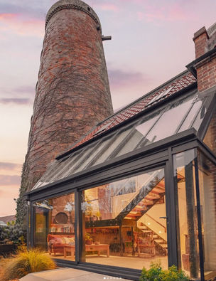 Contemporary extension to a Grade-listed windmill in Eakring Conservation Area, Nottinghamshire, by MO Architects