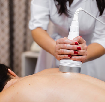 girl-spa-salon-receives-back-neck-massage-lies-cosmetology-table-relaxed-enjoys-process.jp