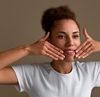portrait-woman-trying-facial-yoga-massage-stay-young.jpg