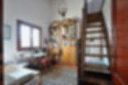 Office with window over, wooden stairs