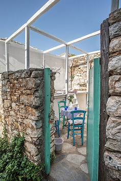 Door opening into a ruin courtyard on Alonissos