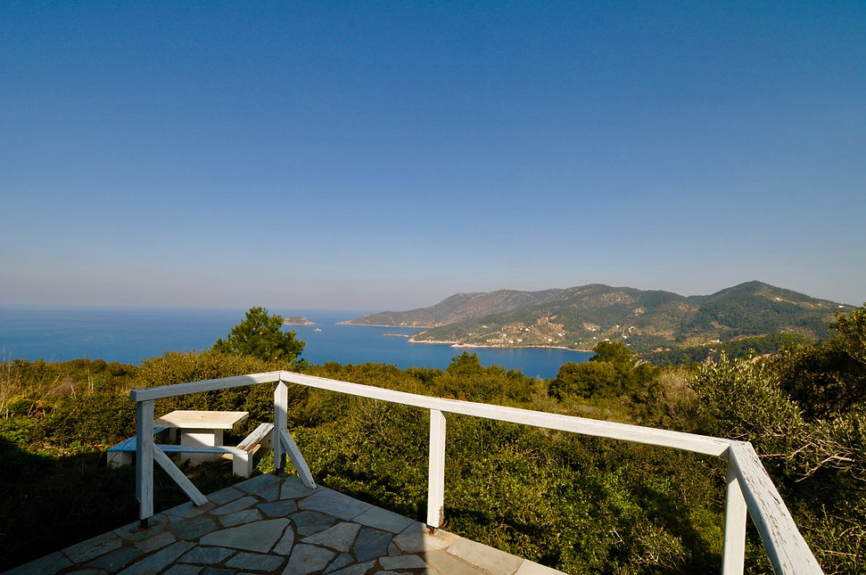 View across countryside and sea from balcony