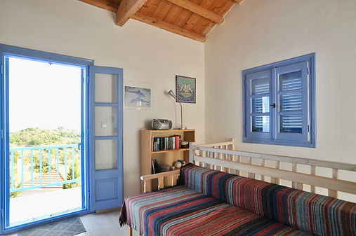 Blue open French windows to blacony in Greece.