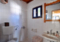 Small white tiled wetroom