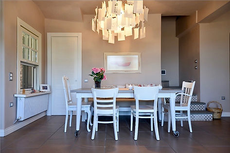 Dining area and steps to upper floor.