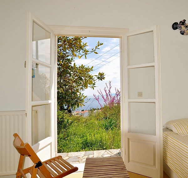 French windows from 2nd bedroom, looking out to the garden.