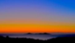 A beautiful sunrise showing orange sky and the islands around Alonissos, Greece.