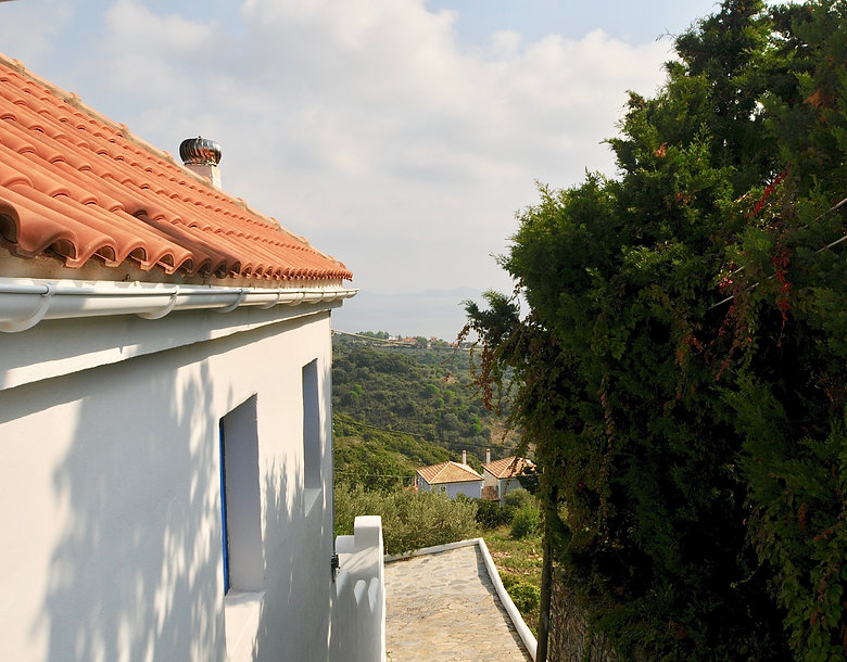 Side of small house and sea view
