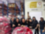 Group photo of Activate staff at the Food from the Heart Headquarters after volunteering