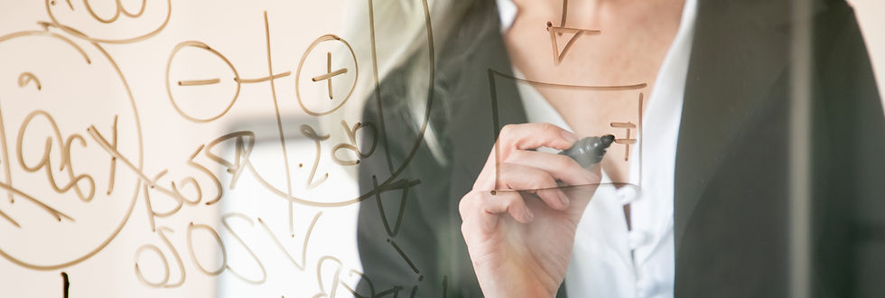 unrecognizable-grey-haired-businesswoman-writing-glass-board-hand-holding-black-marker-mak