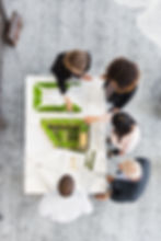 overhead-view-of-architects-discussing-blueprint-2024-10-18-03-54-20-utc.jpg