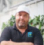 ForemostCo's CEO Joseph Roberts IV posing for company headshots in his Winter Garden, FL greenhouse capture by That Brand Guy.