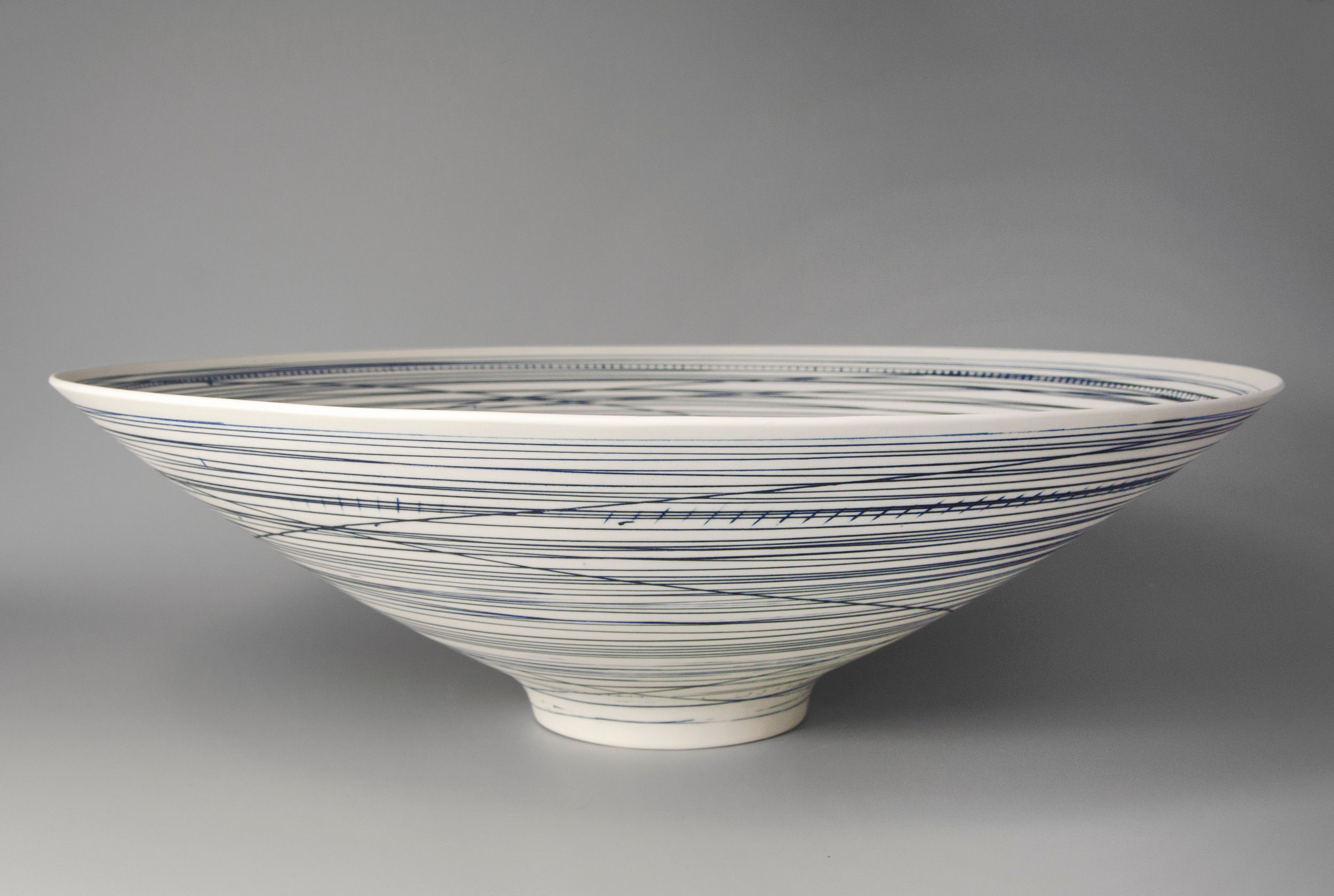 Large, footed bowl. Blue lines