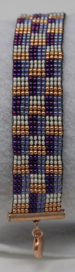 Thumbnail: Purple, Gold, and White Woven Beaded Bracelet