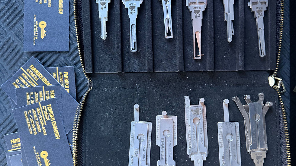 Close-up view of locksmith tools laid out on a workbench