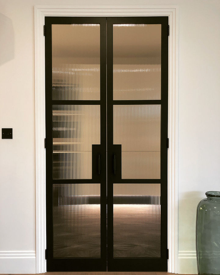 Timber Crittall style doors with Buster & Punch handles.
