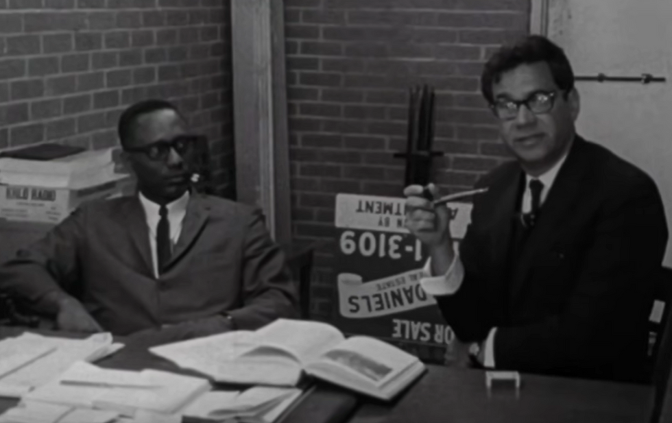 Still from Rush to Judgment with Napoleon Daniels and Mark Lane.