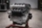 Compact 4-cylinder aluminum engine on workshop