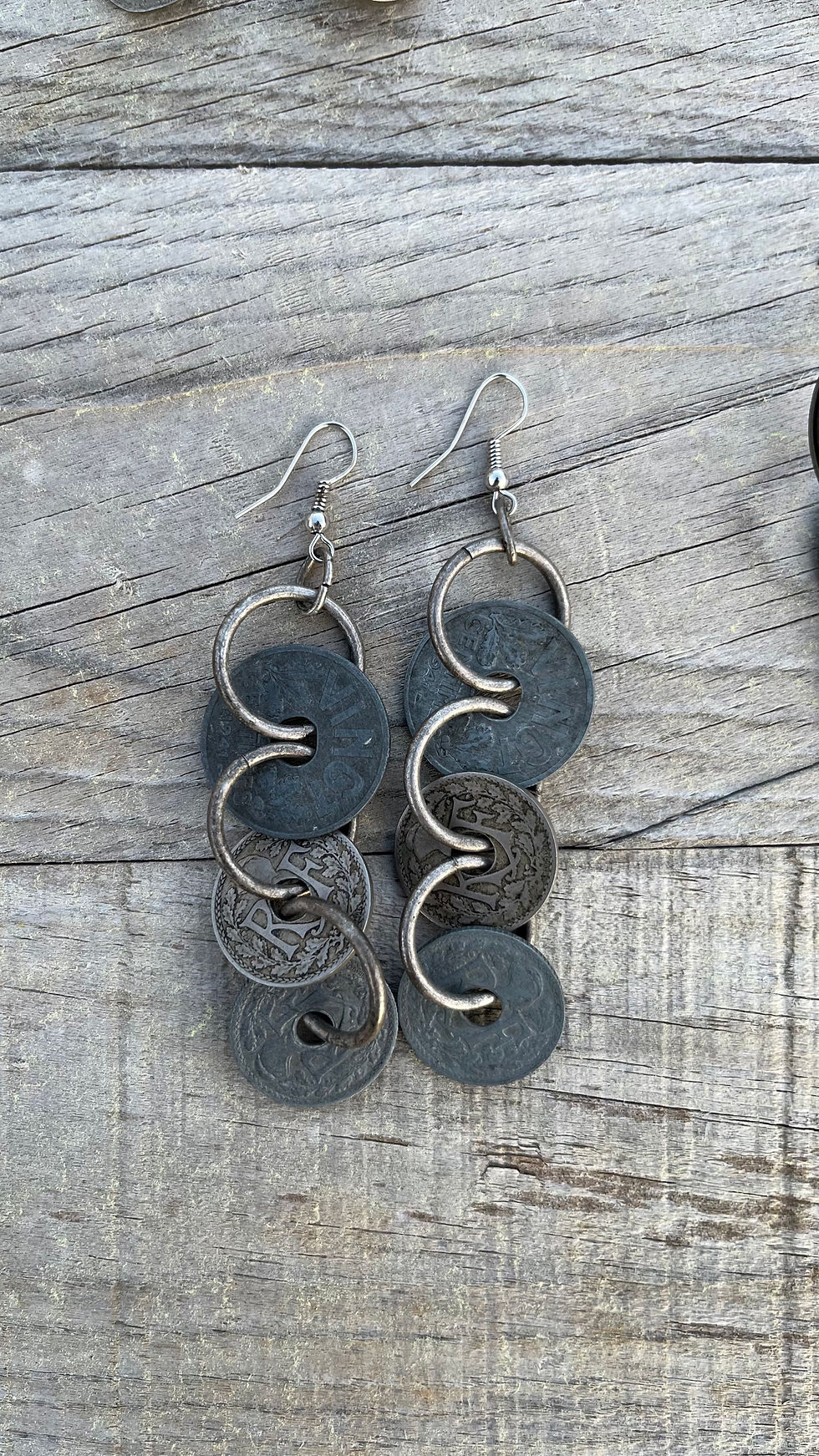 Thumbnail: Pair of dangling earrings with coin design on wood Coins chain ; illanriviere.