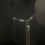 Thumbnail: Silver coins chain belt on mannequin, elegant fashion accessory, close-up view.