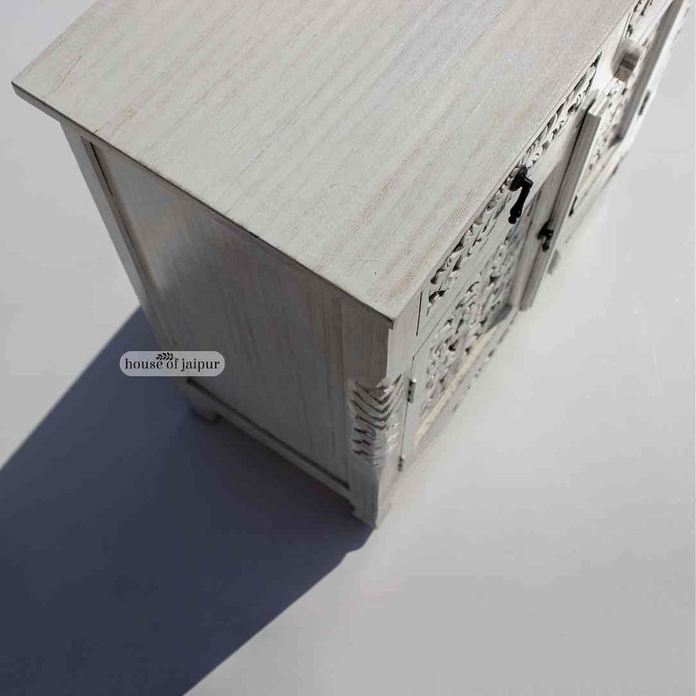 Distressed white hand-carved wooden cabinet with floral carvings, two drawers and two-door storage,