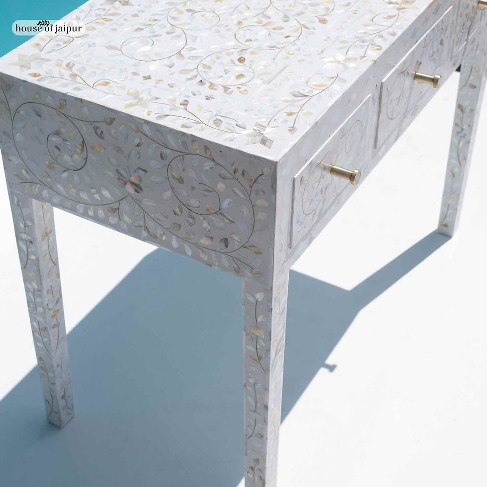 White mother of pearl inlay console table with floral vine pattern and three drawers, handcrafted by House of Jaipur.