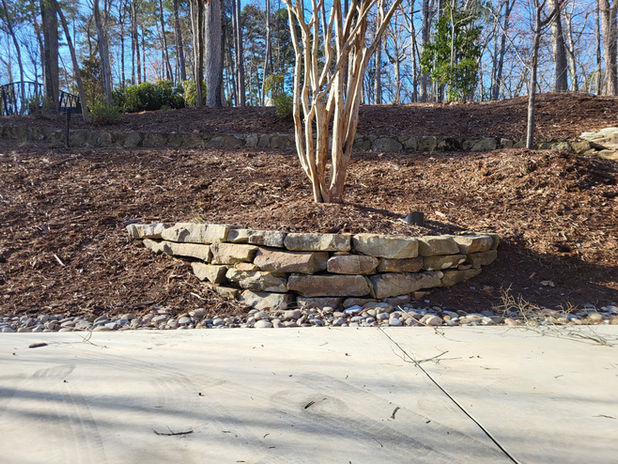 Celestial Landscaping Installed mulch for this big Chapel Hill. Because of existing plantings the whole property must be mulched by wheelbarrow.