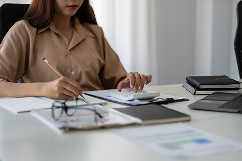 business-woman-taking-note-to-calculate-business-d-2022-08-18-23-50-18-utc.jpeg