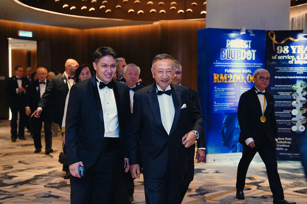 Rtn. Aiman Manan, Installation Organising Chairman, walks alongside Guest of Honour, Yang Amat Mulia Tunku Dato’ Seri Utama Naquiyuddin of Negeri Sembilan, at the Rotary Club of Kuala Lumpur DiRaja’s 98th Installation.