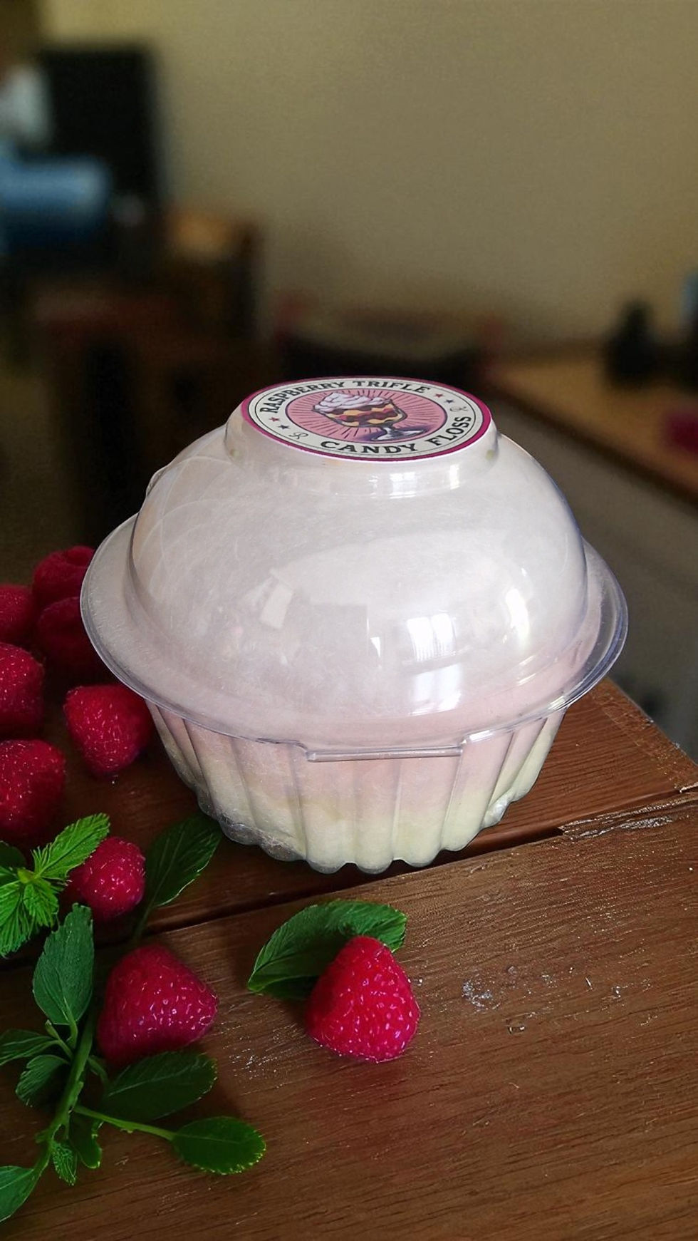 Thumbnail: Cup of multi-layered raspberry trifle candyfloss with custard base, raspberry center, cookies and cream topping, and finished