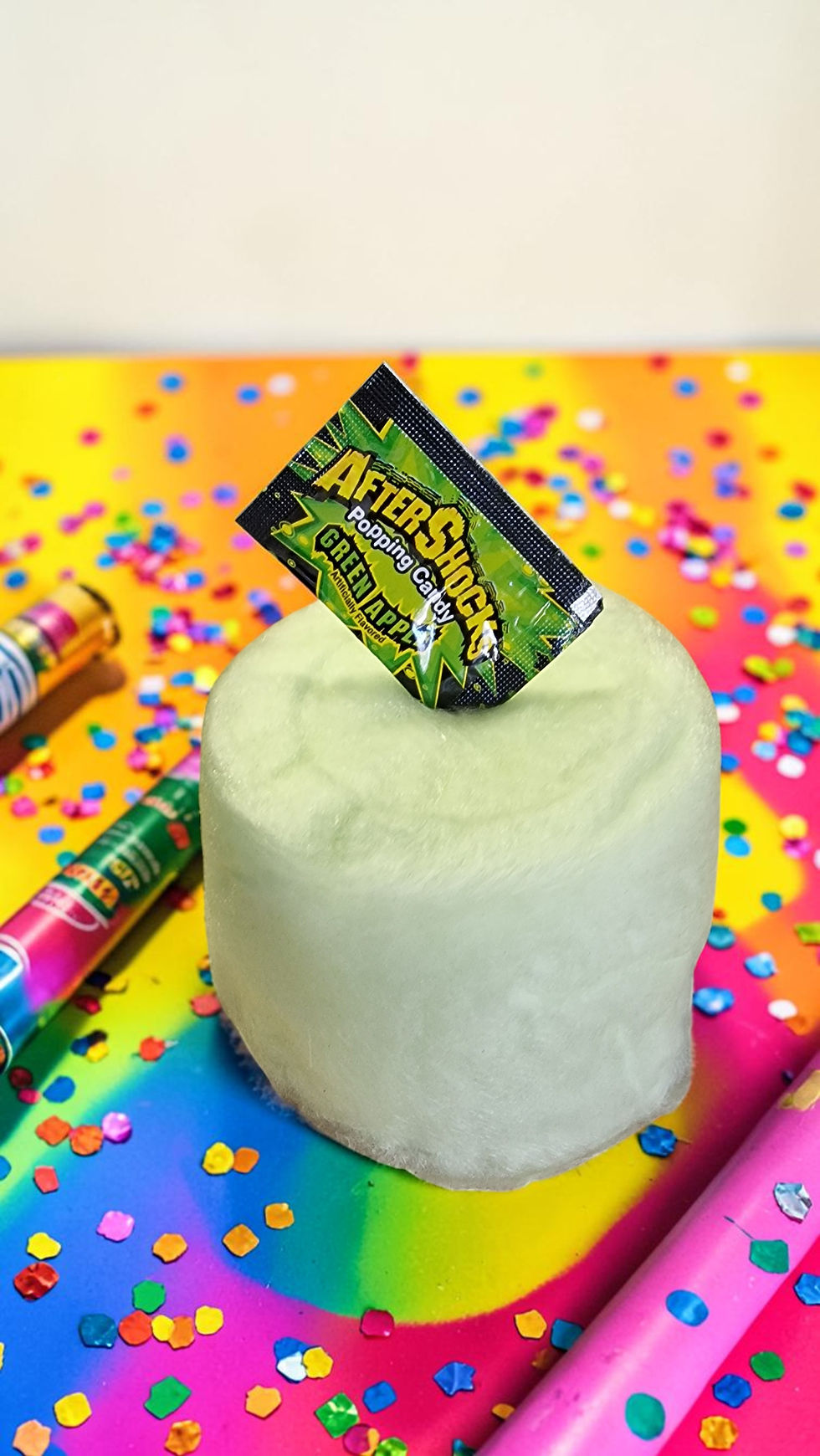 A fun popping candy floss cake with fizzy Aftershock sweets. Perfect for gifts, parties and unique dessert treats.