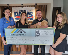 DAY presents ck to Golden PAWS Heroes Fund 2023_WEB.jpg