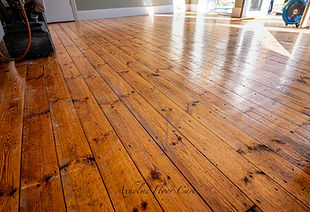 Worn pine floor before sanding in Doncaster with scratches and orange discolouration