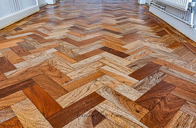Restored teak parquet floor finished with a natural oil
