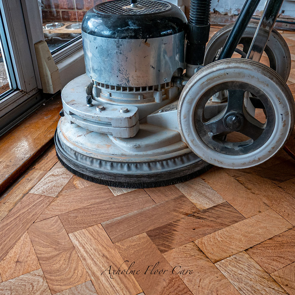 Close-up view of sanding machine smoothing a wooden floor