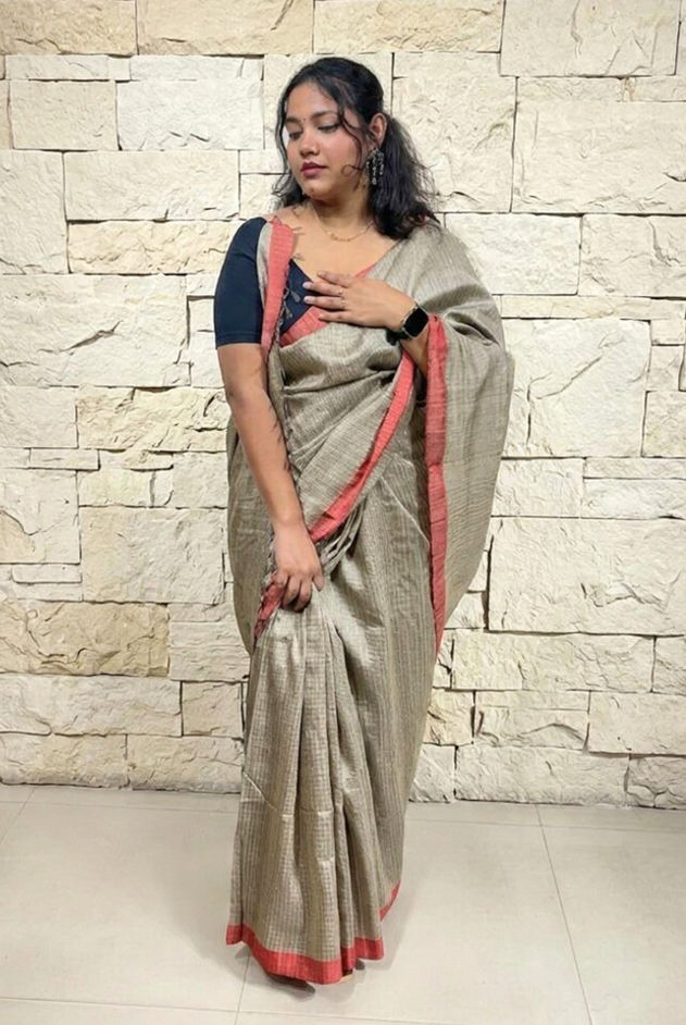 Natural beige wirh coral border tussar silk saree. Best tasar silk in India. Shop now.